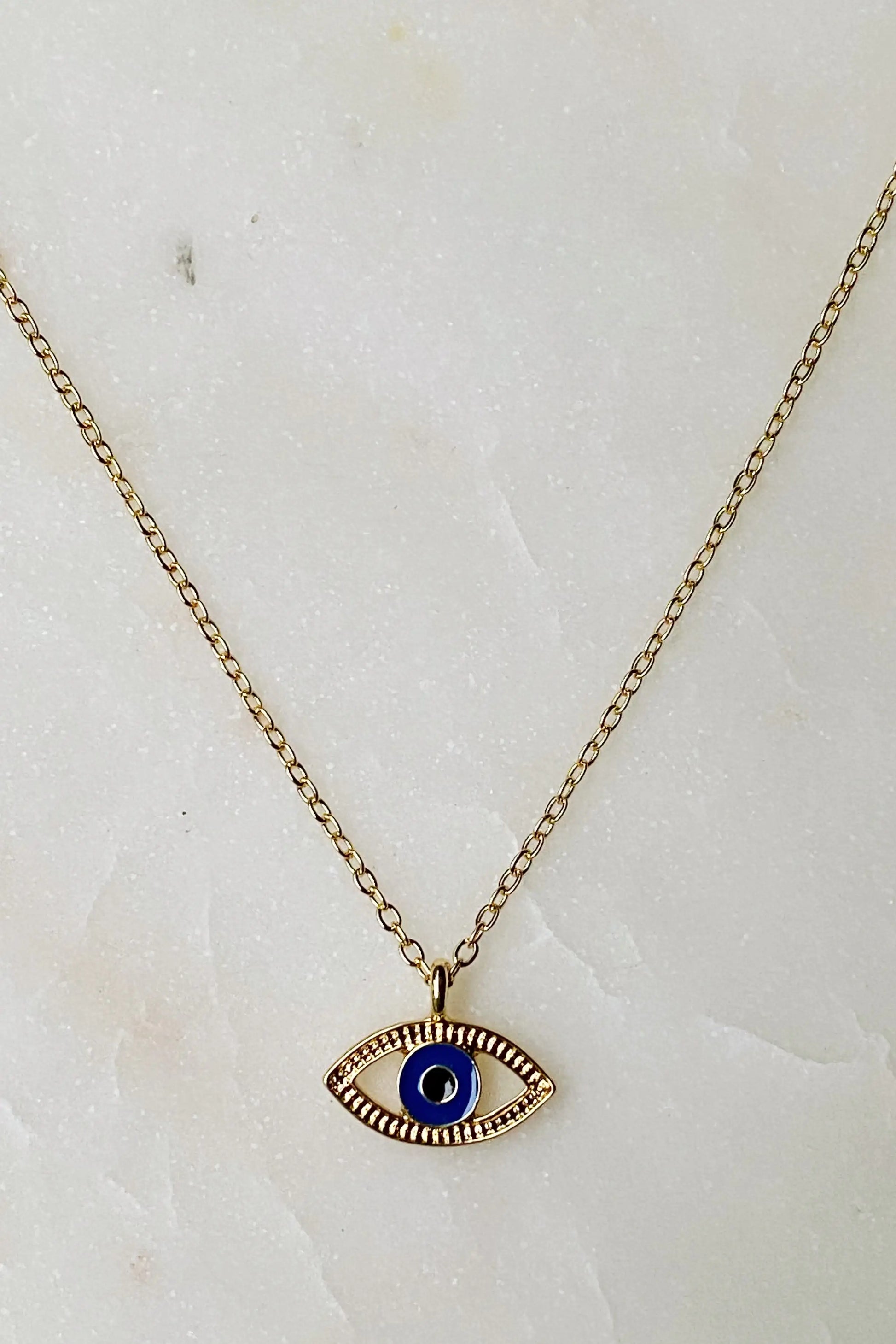 Evil eye necklace close-up - blue enamel detail zinc alloy 18K plated protective charm pendant